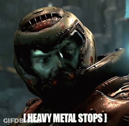 A Man In A Helmet With The Words Heavy Metal Stops Below Him GIF
