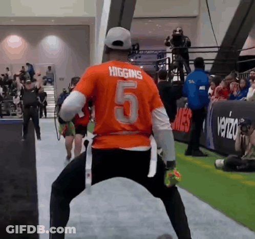 A Man In A Higgins Number 5 Jersey Is Dancing GIF