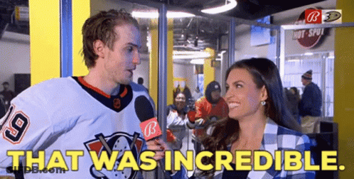 A Man In A Hockey Jersey Is Being Interviewed By A Woman With The Words That Was Incredible GIF