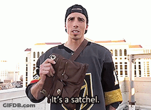 A Man In A Hockey Jersey Is Holding A Bag And Says It 'S A Satchel GIF