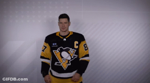 A Man In A Hockey Jersey With The Number 8 On It GIF