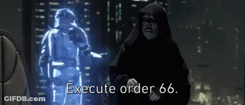 A Man In A Hood Says Execute Order 66 In Front Of A Hologram Of A Storm Trooper GIF