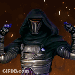 A Man In A Hooded Armor Stands In Front Of A Fire GIF