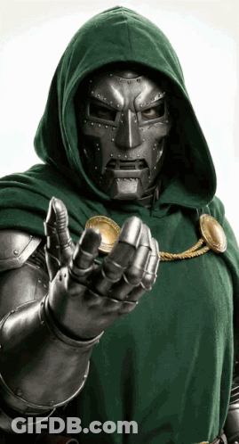 A Man In A Hooded Cape Is Holding A Gold Coin GIF
