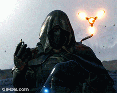 A Man In A Hooded Cape Is Holding A Light In Front Of Him GIF