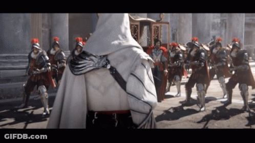 Hooded Cape Man Standing In Front Of Soldiers GIF