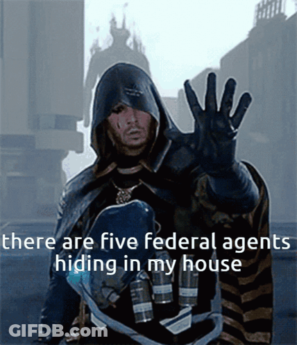 A Man In A Hooded Cape With The Words There Are Five Federal Agents Hiding In My House GIF
