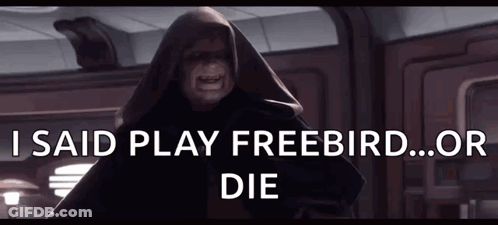 A Man In A Hooded Cloak With The Words I Said Play Freebird Or Die Above Him GIF