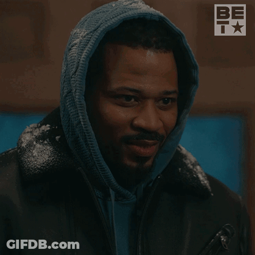 A Man In A Hooded Jacket Has The Word Magic On His Face GIF