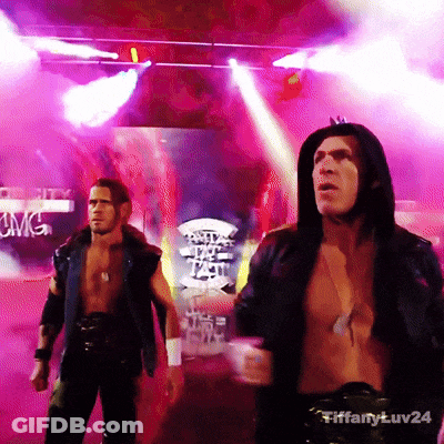 A Man In A Hooded Jacket Is Standing In Front Of A Sign That Says Cwc GIF