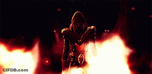 A Man In A Hooded Jacket Is Surrounded By Flames And Smoke GIF