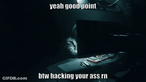 A Man In A Hooded Jacket Is Typing On A Computer With The Words Yeah Good Point Btw Hacking Your Ass GIF
