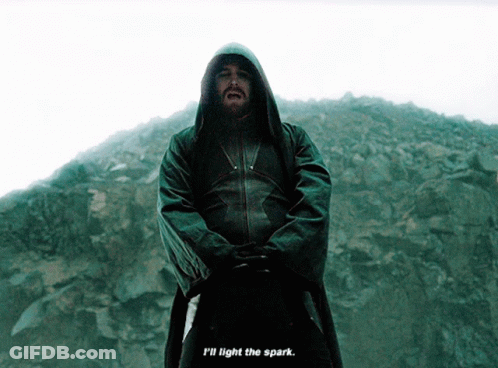 A Man In A Hooded Jacket With The Words " I 'Ll Light The Spark " Below Him GIF