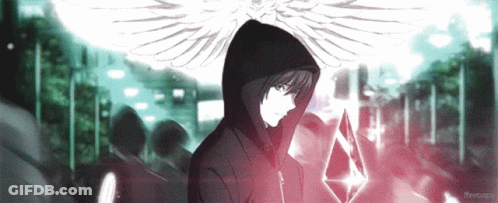 A Man In A Hooded Jacket With Wings Holds A Crystal GIF