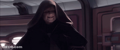 A Man In A Hooded Robe With The Letter O On His Chest GIF