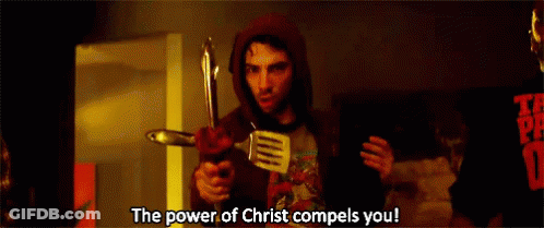 A Man In A Hoodie Is Holding A Spatula And A Knife And Says The Power Of Christ Compels You GIF