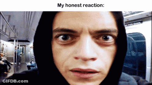 A Man In A Hoodie Is Looking At The Camera With A Caption That Says My Honest Reaction . GIF