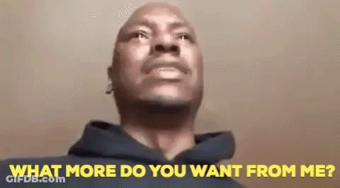A Man In A Hoodie Is Looking Up At The Camera And Says `` What More Do You Want From Me ? '' GIF