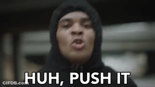 A Man In A Hoodie Is Making A Funny Face And Says `` Huh , Push It '' . GIF