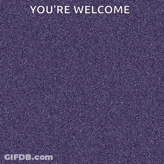 A Man In A Hoodie Is Standing With His Arms Crossed In Front Of A Purple Track . GIF