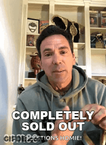 A Man In A Hoodie Says Completely Sold Out In Front Of A Bookshelf . GIF