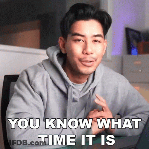 A Man In A Hoodie Says " You Know What Time It Is " While Sitting In Front Of A Laptop GIF