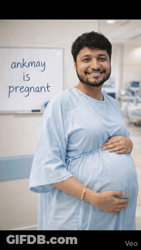 A Man In A Hospital Gown Is Pregnant GIF