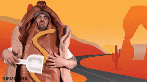 A Man In A Hot Dog Costume Holds A Shovel In His Hand GIF