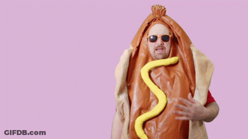 A Man In A Hot Dog Costume Is Pointing At The Camera And Says Me No You GIF
