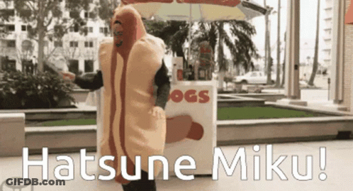 A Man In A Hot Dog Costume Is Standing In Front Of A Hot Dog Stand GIF