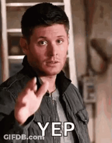 A Man In A Jacket Is Pointing His Finger At The Camera And Saying Yep . GIF