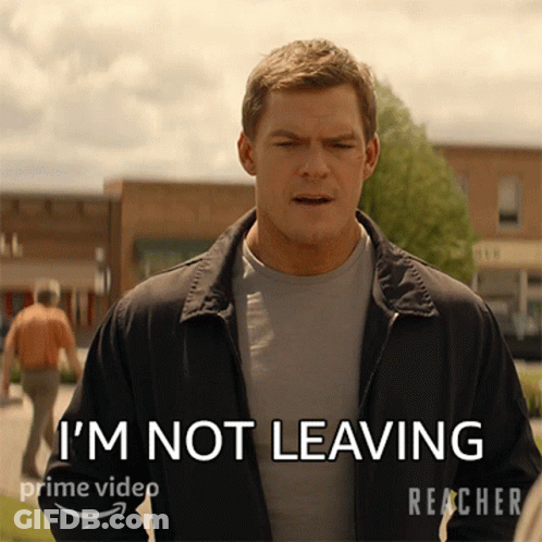 A Man In A Jacket Says " I 'M Not Leaving " On A Screen GIF