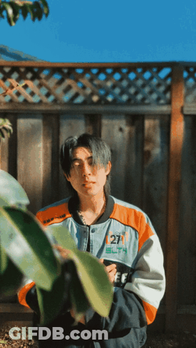 A Man In A Jacket With The Number 27 On It GIF