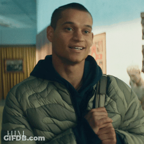 A Man In A Jacket With The Word Him On The Bottom GIF