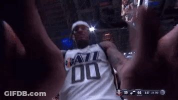 A Man In A Jazz Jersey Is Taking A Selfie GIF