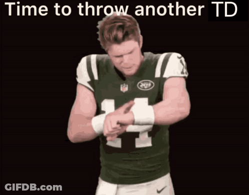A Man In A Jets Jersey Is Pointing At The Camera With The Words Time To Throw Another Td Above Him GIF