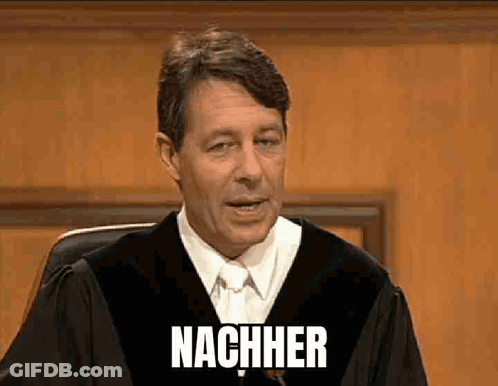 A Man In A Judge 'S Robe Is Giving A Speech And The Word Nachher Is On The Screen Behind Him GIF