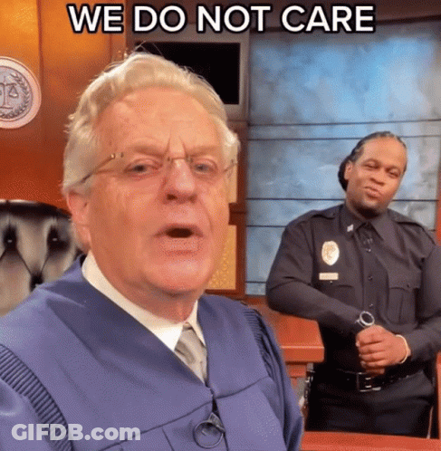 A Man In A Judge 'S Robe Says " We Do Not Care " In Front Of A Police Officer GIF