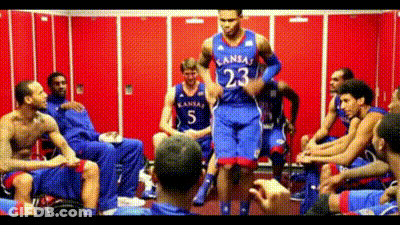 A Man In A Kansas Jersey Jumps In The Air GIF