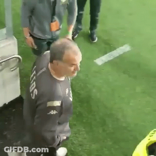 A Man In A Kappa Shirt Is Walking On A Field GIF