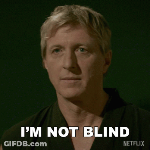 A Man In A Karate Uniform Says I 'M Not Blind On A Green Background GIF