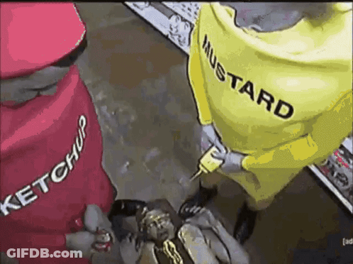 A Man In A Ketchup And Mustard Costume Is Holding A Gun GIF
