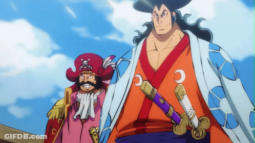 A Man In A Kimono Holds A Sword Next To A Man In A Red Hat With A Skull And Crossbones On It GIF