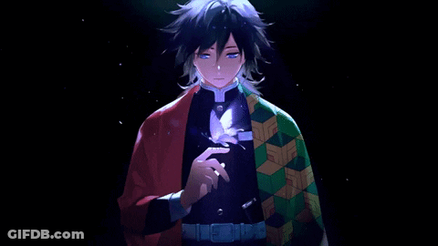 A Man In A Kimono Is Holding A Feather In His Hand . GIF