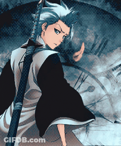 A Man In A Kimono Is Holding A Sword GIF