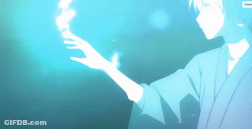 A Man In A Kimono Is Holding Something In His Hand GIF
