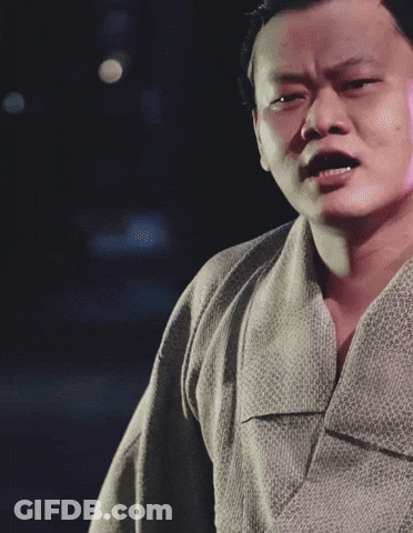 A Man In A Kimono Making A Funny Face GIF