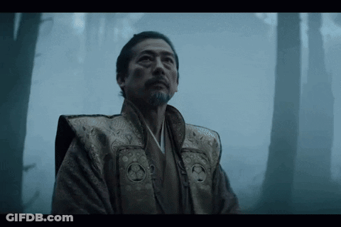 A Man In A Kimono Stands In A Foggy Forest Looking Up GIF