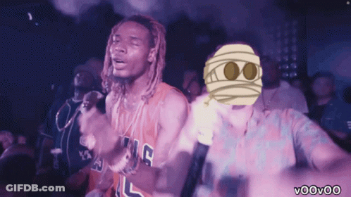 A Man In A Kings Jersey Stands Next To Another Man With A Mummy Mask On His Face GIF