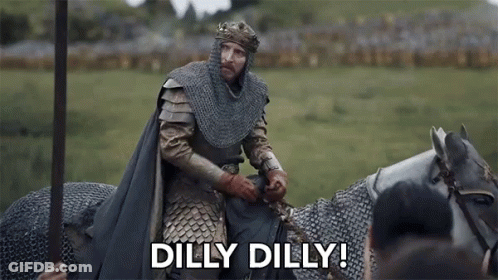 A Man In A Knight 'S Armor Is Riding A Horse And Saying `` Dilly Dilly '' . GIF